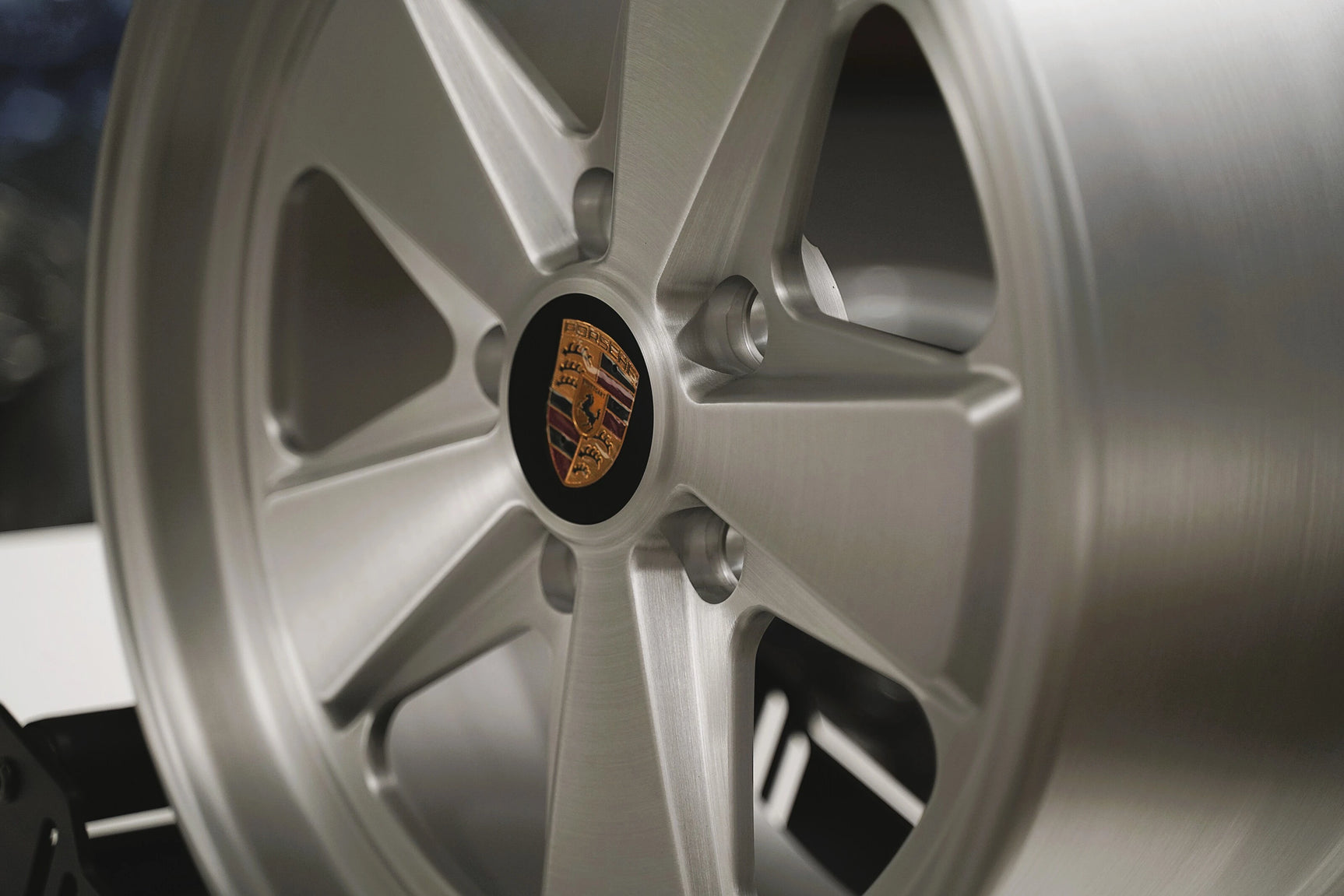 Close-up of a Satin Brushed silver 5x130 Custom Classic fuch wheel for porsche 