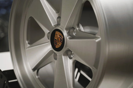 Close-up of a Satin Brushed silver 5x130 Custom Classic fuch wheel for porsche 