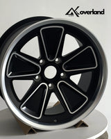 Studio shot of Porsche custom forged wheels in 5x130 bolt pattern, reimagined Fuchs design with precision CNC machining