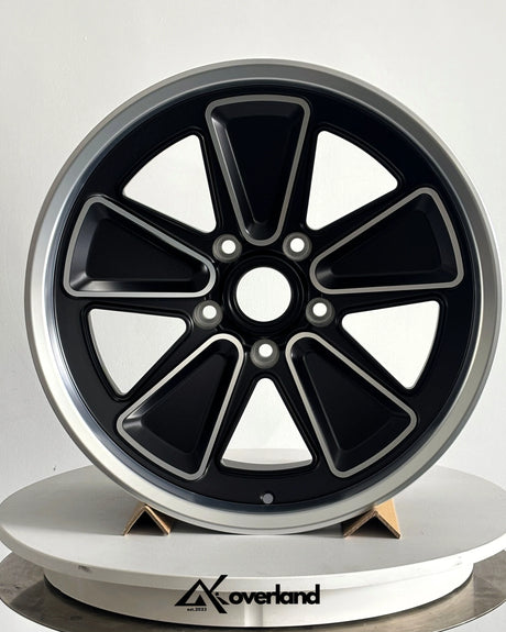 Porsche forged wheels photographed in studio, featuring reimagined Fuchs design and high-precision CNC-machined surfaces