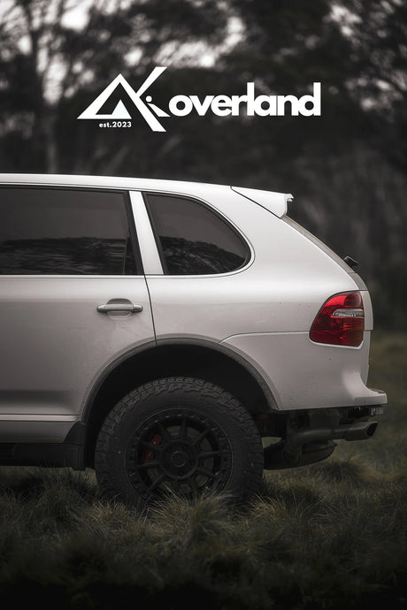 Gen1 Cayenne 957 rear view lifted suspension spring lift kit subframe drop overland build by akioverland