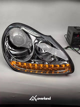 Porsche Cayenne 955 LED projector headlight showing amber turn signal and upgraded lighting design.