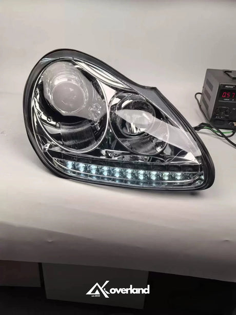 Porsche Cayenne 955 LED projector headlight with white daytime running light upgrade.