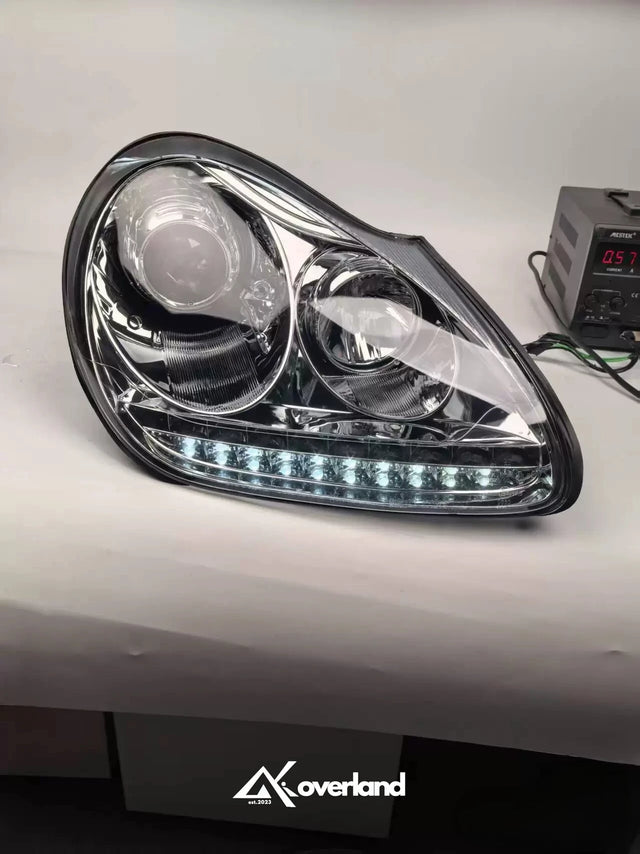 Porsche Cayenne 955 LED projector headlight with white daytime running light upgrade.